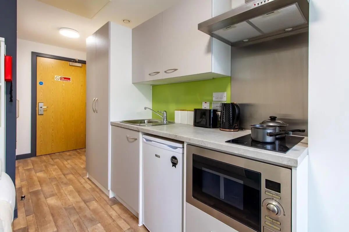 Modern student kitchen with microwave kettle and hob kitchen at Plymouth Cross House in Plymouth Student Accommodation