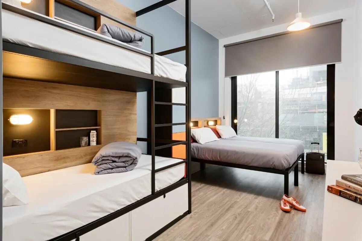 Bunk beds two twin beds and suitcase bedroom at The G Living in Perth Student Accommodation