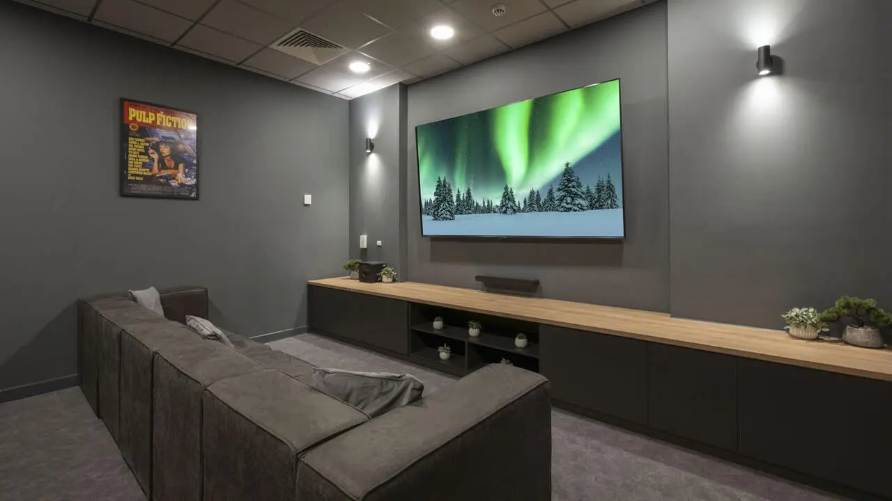 Large sectional couch facing large television living room at St Gabriels in Manchester Student Accommodation