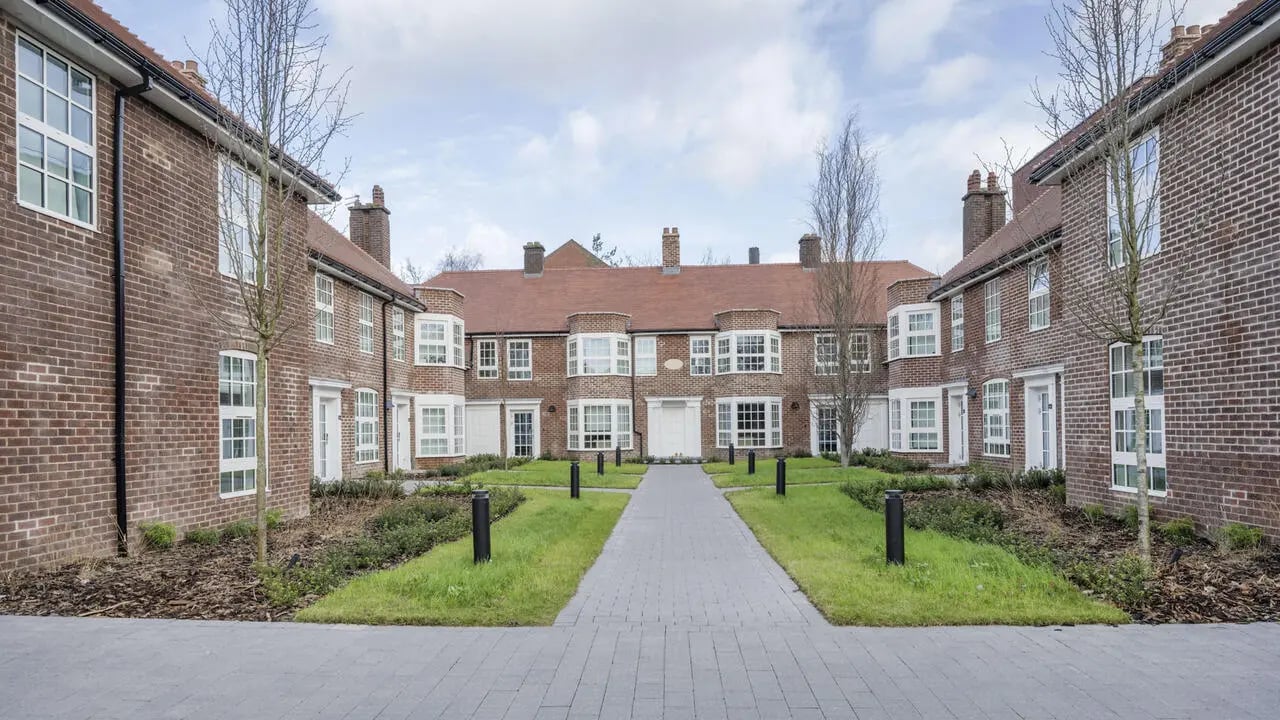 Brick buildings with bay windows path exterior at St Gabriels in Manchester Student Accommodation
