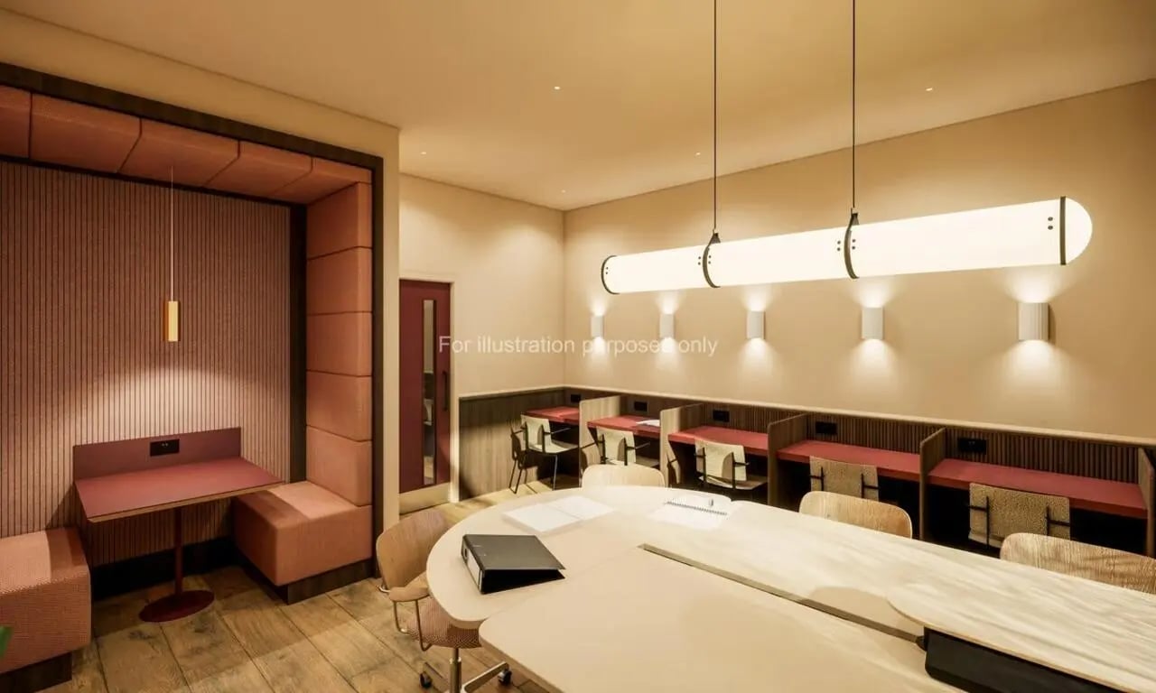 Study desks and seating with large table Study area at Swan Residences in Glasgow Student Accommodation