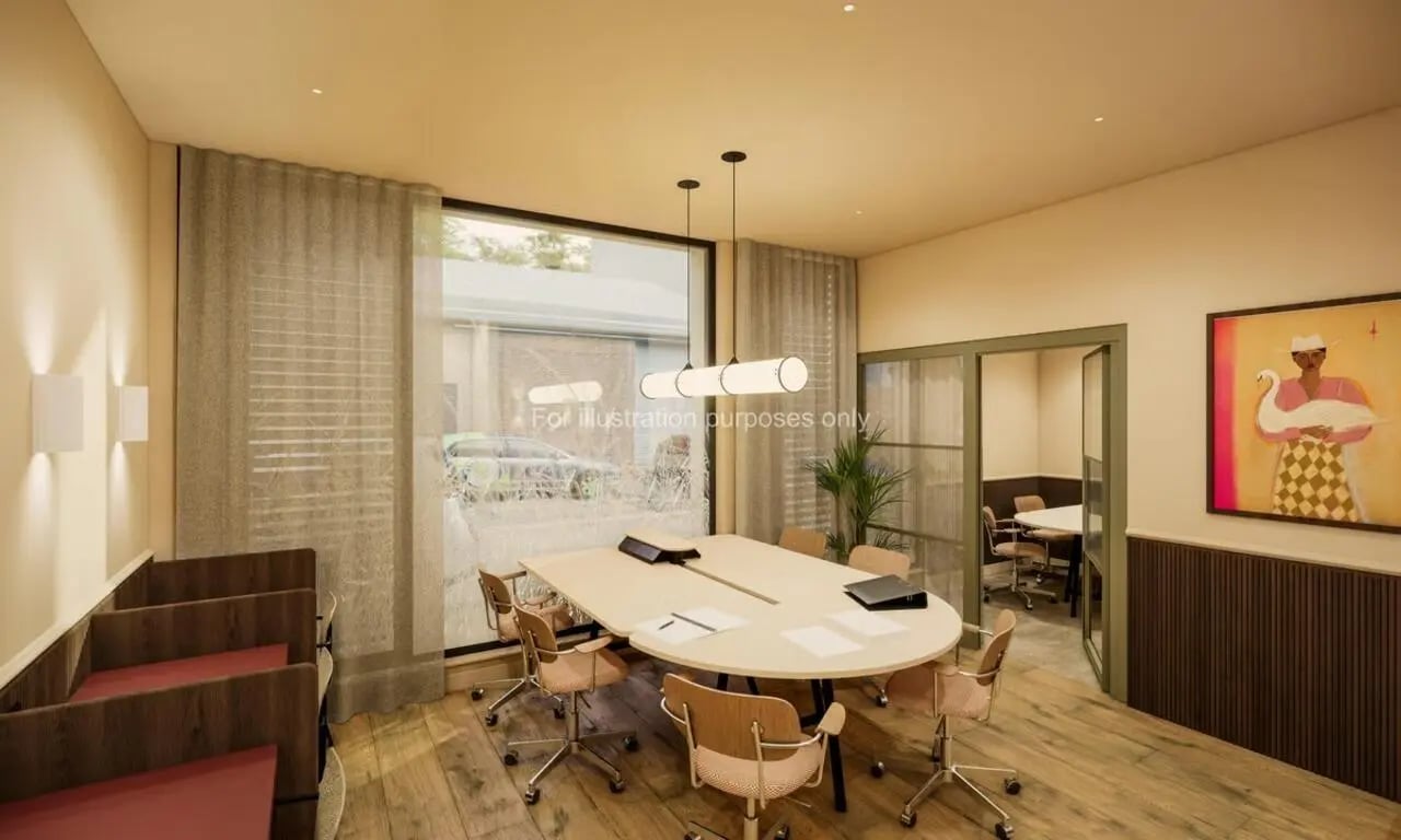 Oval table with chairs and artwork meeting room at Swan Residences in Glasgow Student Accommodation