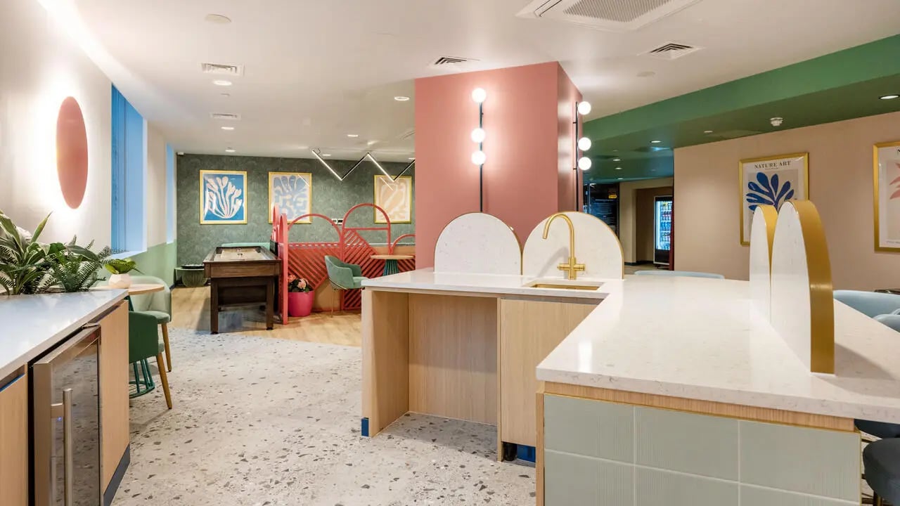 Shuffleboard table counter and sink common area at Wick Park in London Student Accommodation