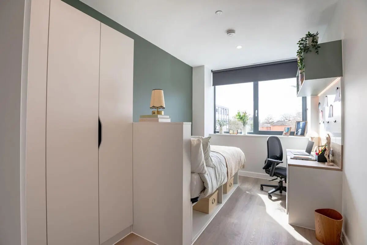 Closet bed desk and chair student bedroom at Yugo Haüs in Birmingham Student Accommodation
