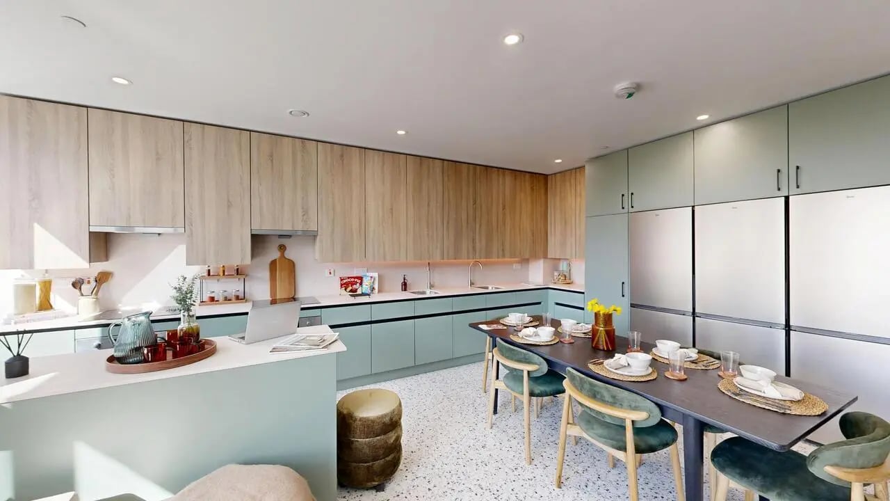 Modern kitchen with dining table and fridges kitchen at Yugo Haüs in Birmingham Student Accommodation