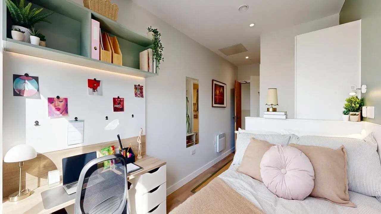 Desk with laptop plants and bed bedroom at Yugo Haüs in Birmingham Student Accommodation