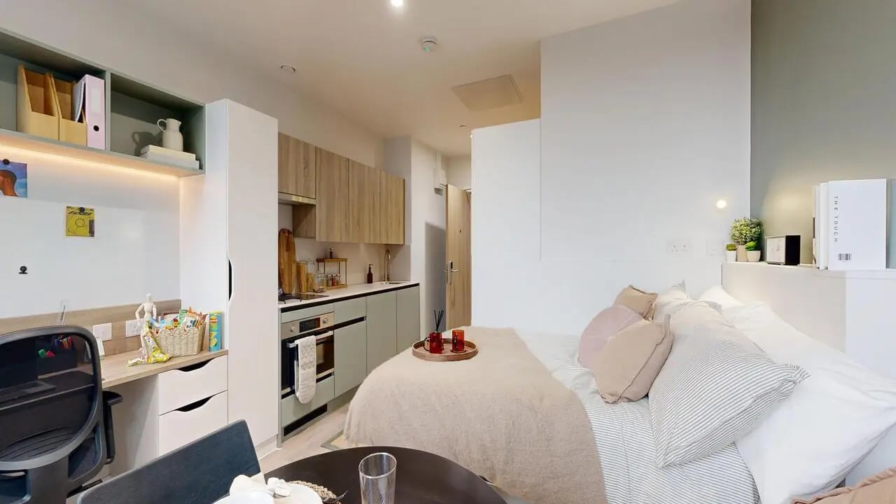 Desk kitchen and bed studio apartment at Yugo Haüs in Birmingham Student Accommodation