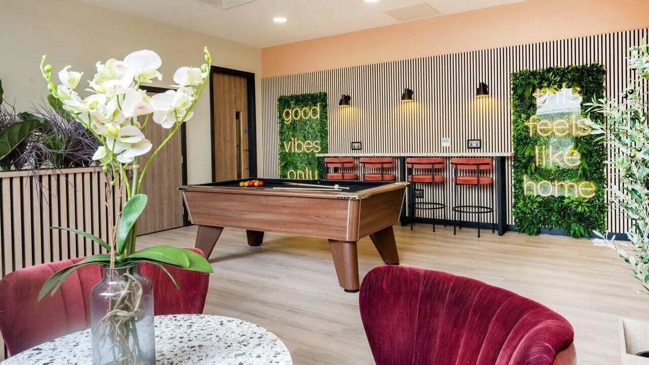 Pool table bar stools neon signs lounge area at Fontenoy Apartments in Liverpool Student Accommodation