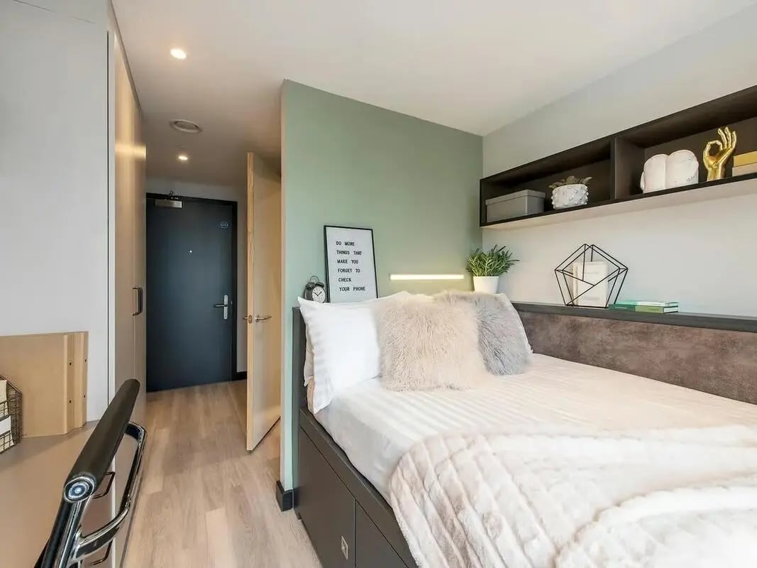 Bed with fluffy pillows and cozy blanket bedroom at Zenith in Cardiff Student Accommodation