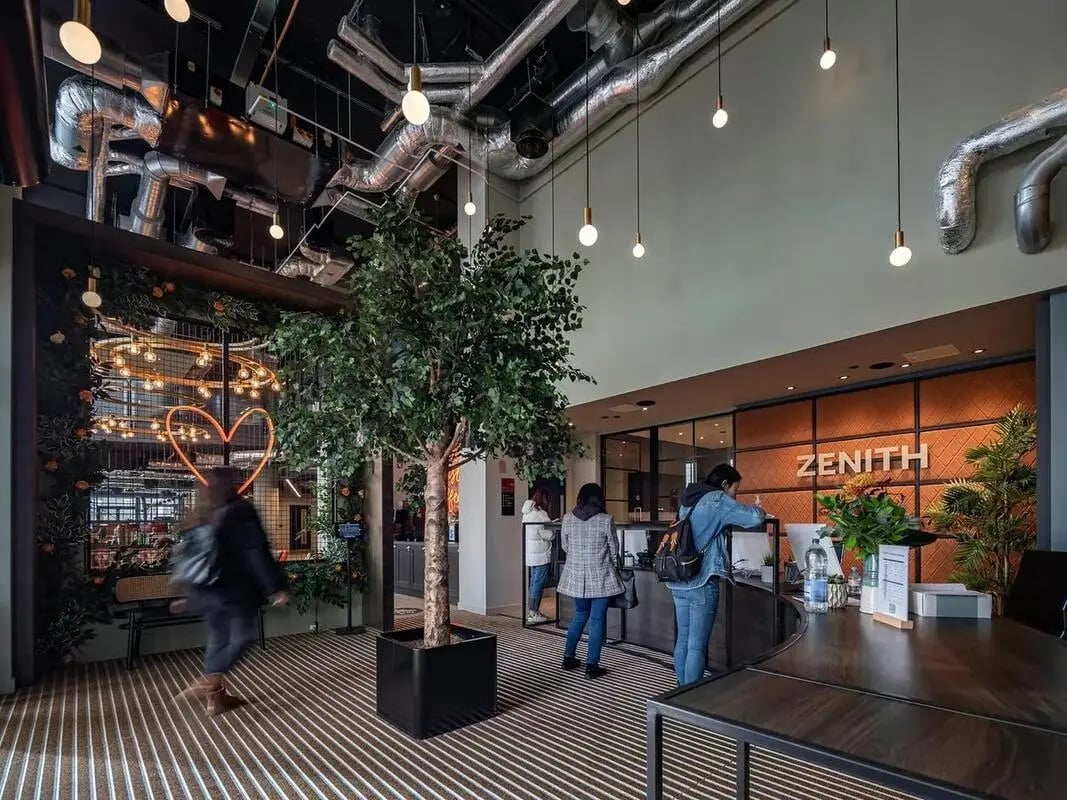 Reception area with tree and ZENITH logo exterior at Zenith in Cardiff Student Accommodation