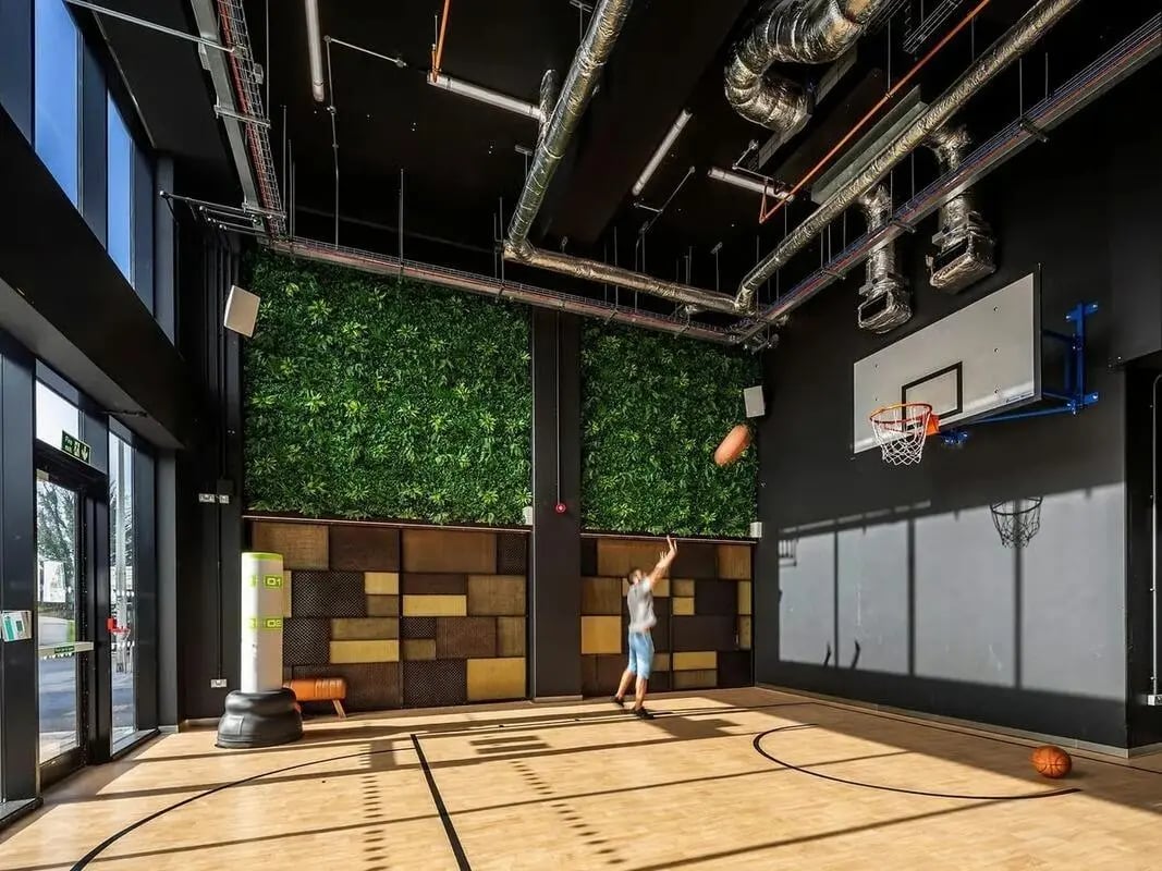 Student plays basketball in modern recreational space at Zenith in Cardiff Student Accommodation