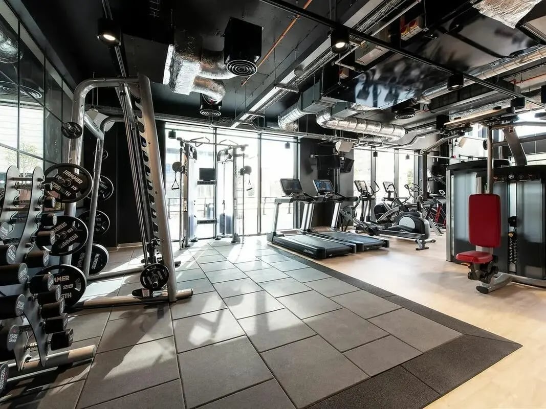 Dumbbells treadmills weight machines modern gym interior gym at Zenith in Cardiff Student Accommodation