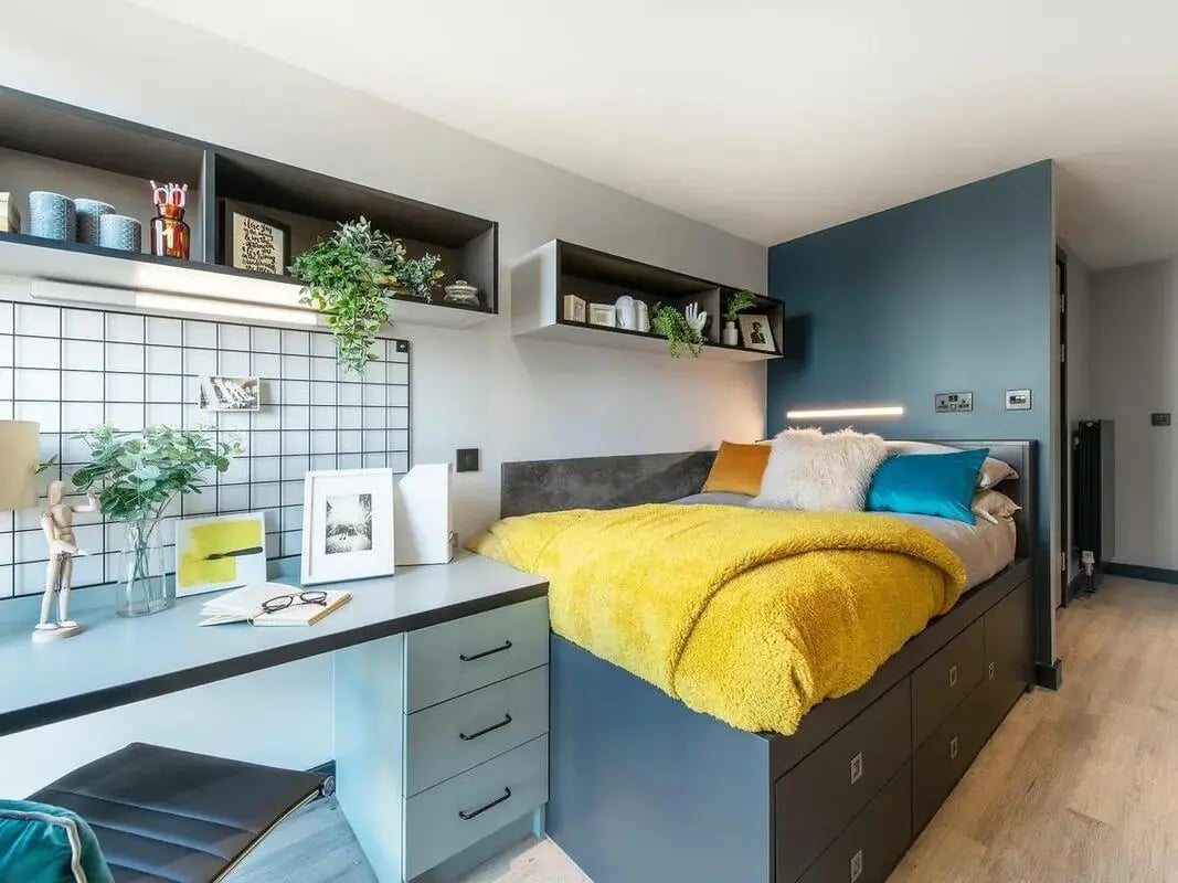 Desk bed with storage and plants bedroom at Zenith in Cardiff Student Accommodation
