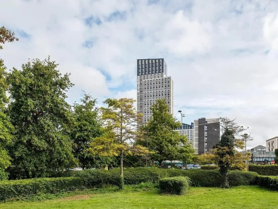 Tall buildings surrounded by green trees exterior at Zenith in Cardiff Student Accommodation