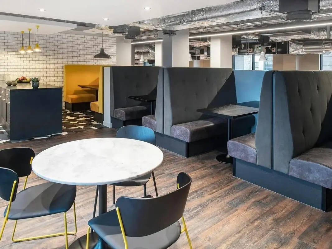Banquette seating and tables communal area at Zenith in Cardiff Student Accommodation