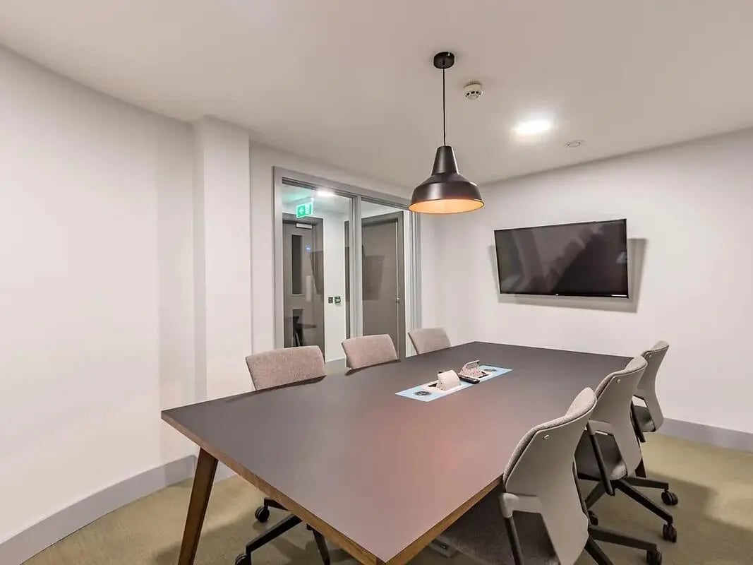 Table chairs television meeting room at ViBe Student Living in Kingston Upon Thames Student Accommodation