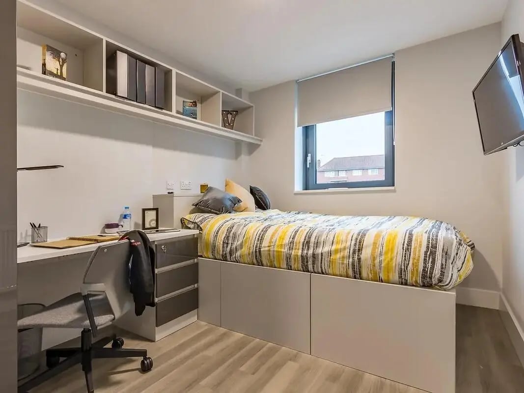 Bed desk and shelves bedroom at ViBe Student Living in Kingston Upon Thames Student Accommodation