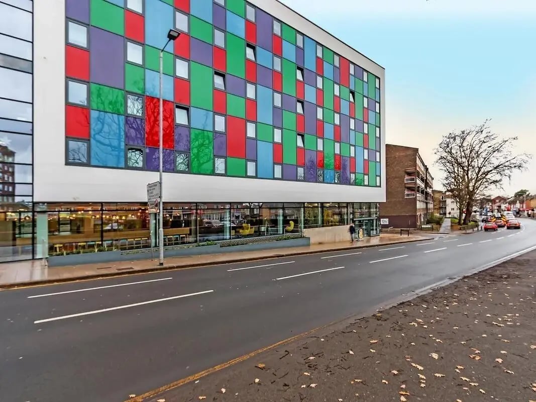Colorful modern building with ground floor common area exterior at ViBe Student Living in Kingston Upon Thames Student Accommodation