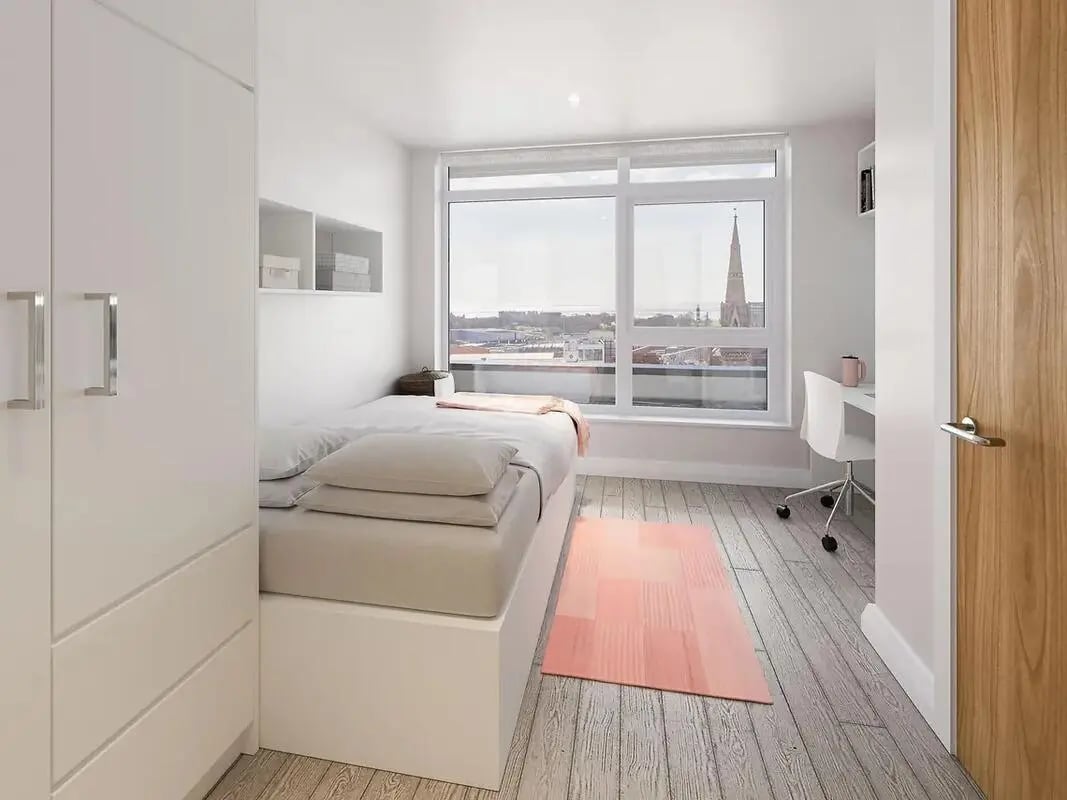 Bed desk wardrobe and window view bedroom at The Reservoir in Plymouth Student Accommodation