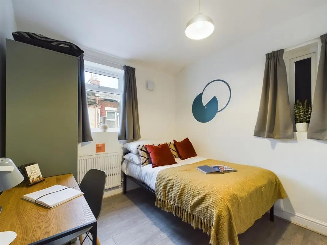 Bed desk wardrobe and wall art bedroom at 4 Bedroom House at 102, Leopold Road in Liverpool Student Accommodation