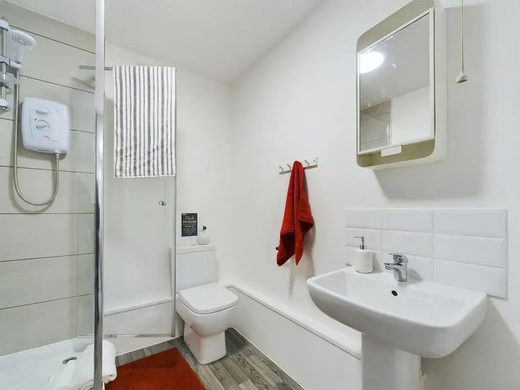 Shower toilet sink medicine cabinet bathroom at 6 Bedroom House at 2, Flat 2, Windsor House, Clint Road West in Liverpool Student Accommodation