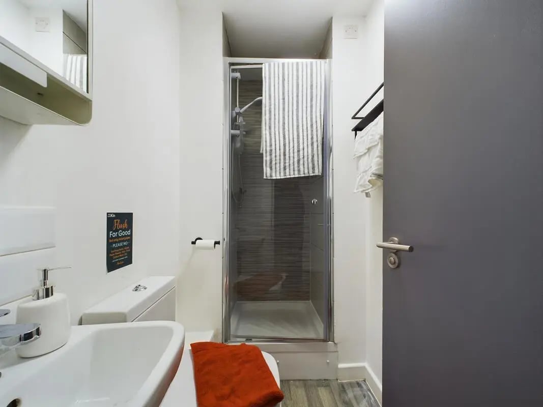 Toilet sink shower with towel bathroom at 6 Bedroom House at 2, Flat 2, Windsor House, Clint Road West in Liverpool Student Accommodation