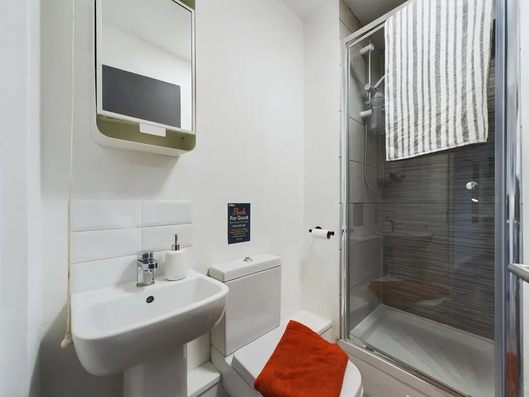 Sink toilet shower and towel bathroom at 6 Bedroom House at 2, Flat 2, Windsor House, Clint Road West in Liverpool Student Accommodation