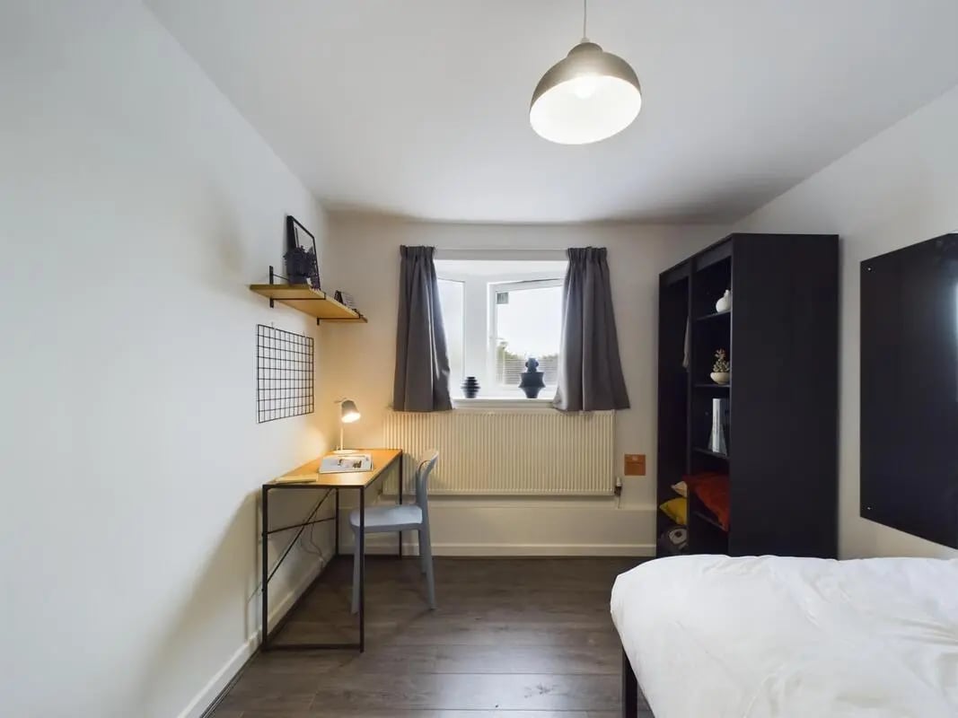Desk chair lamp shelves wardrobe bed bedroom at 6 Bedroom House at 2, Flat 2, Windsor House, Clint Road West in Liverpool Student Accommodation
