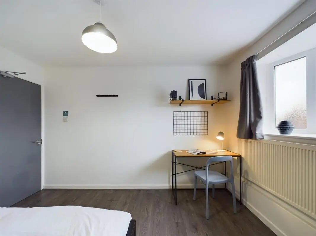Desk chair lamp shelves and door bedroom at 6 Bedroom House at 2, Flat 2, Windsor House, Clint Road West in Liverpool Student Accommodation