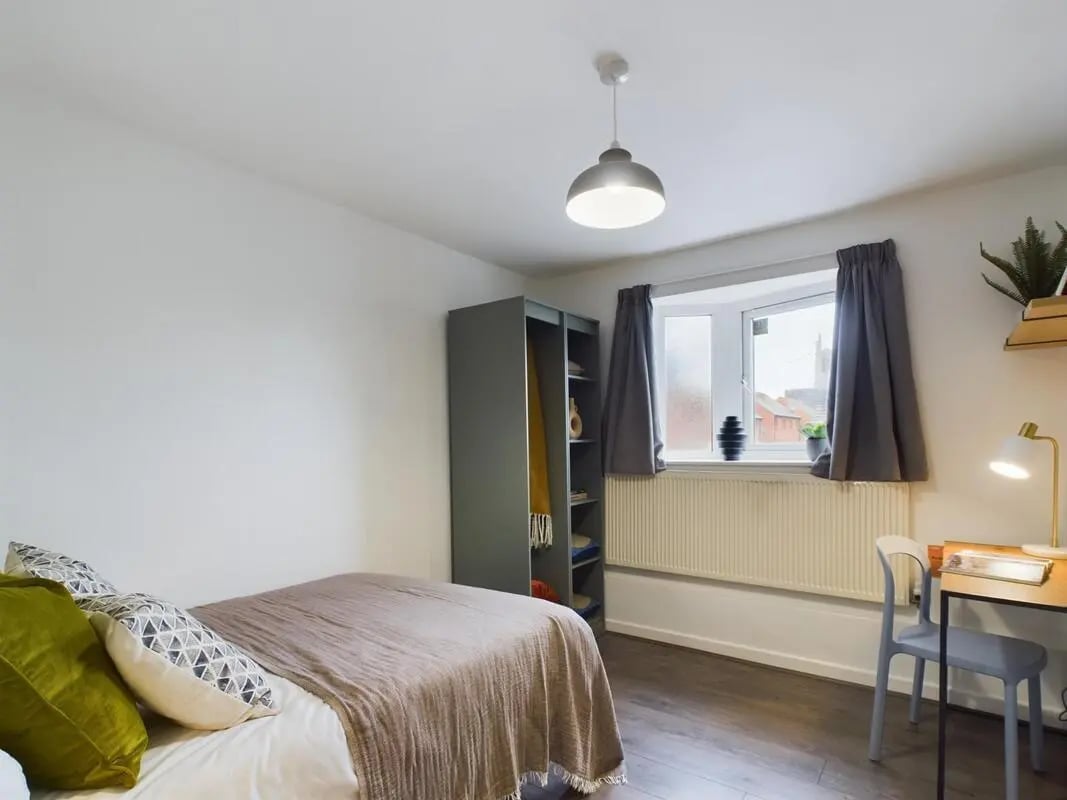 Bed wardrobe desk and window bedroom at 6 Bedroom House at 2, Flat 2, Windsor House, Clint Road West in Liverpool Student Accommodation