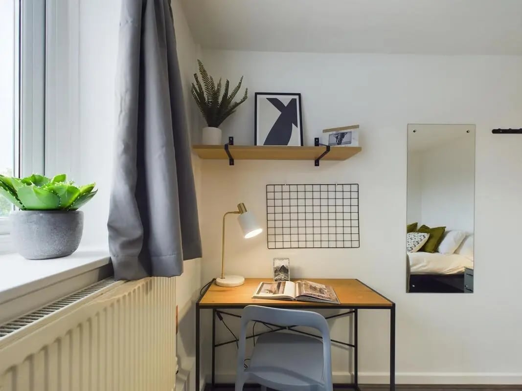 Desk lamp plants and mirror bedroom at 6 Bedroom House at 2, Flat 2, Windsor House, Clint Road West in Liverpool Student Accommodation