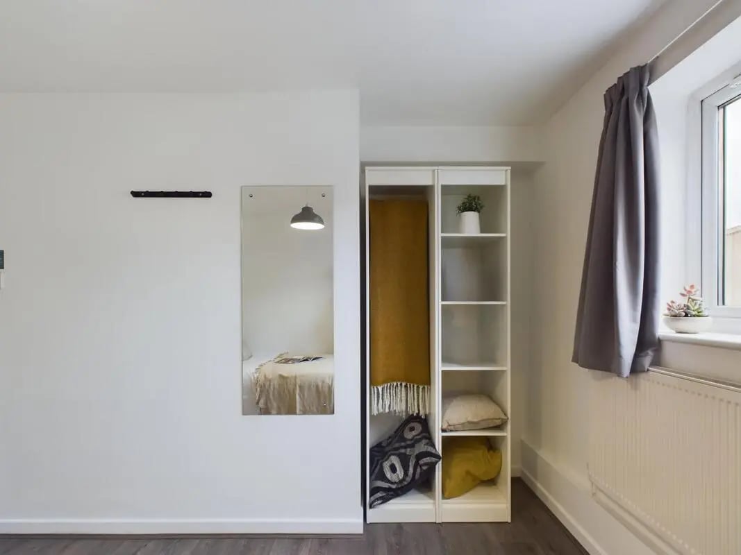 Wardrobe shelves mirror reflected bed bedroom at 6 Bedroom House at 2, Flat 2, Windsor House, Clint Road West in Liverpool Student Accommodation