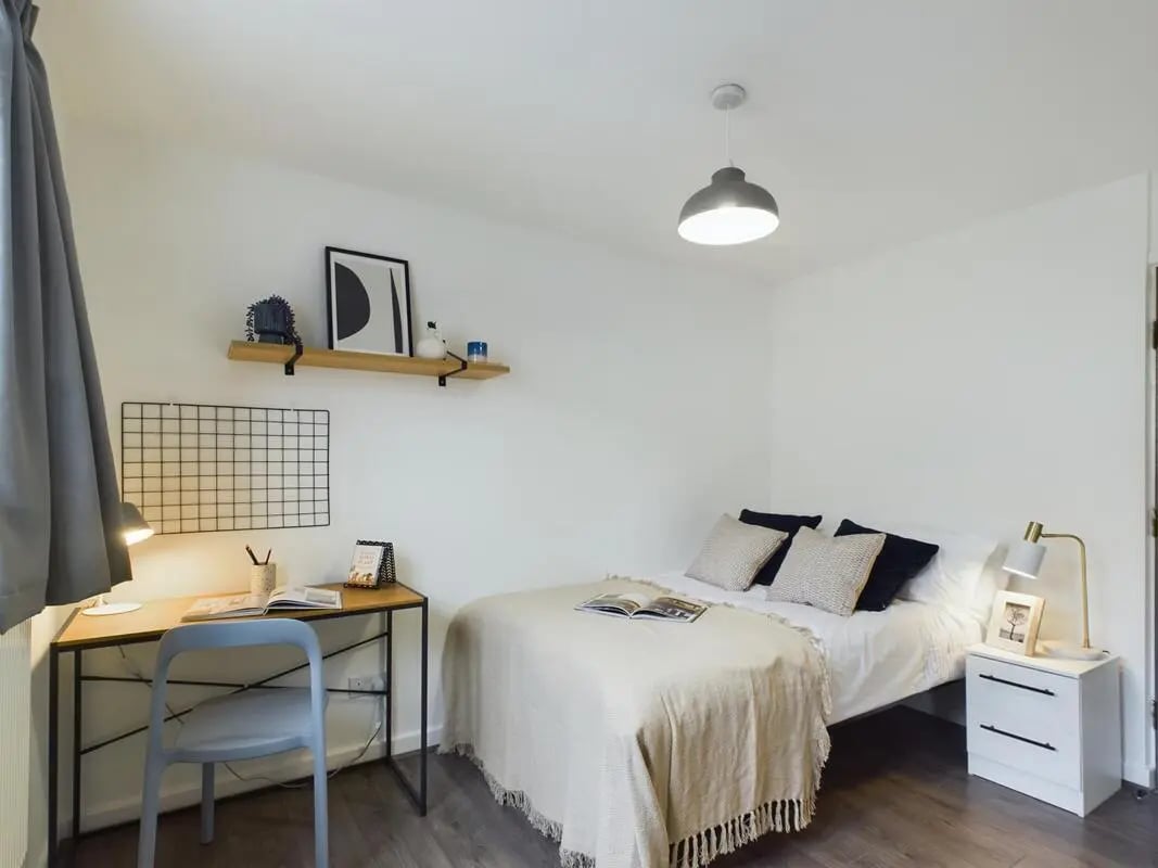 Bed desk chair shelf and nightstand bedroom at 6 Bedroom House at 2, Flat 2, Windsor House, Clint Road West in Liverpool Student Accommodation