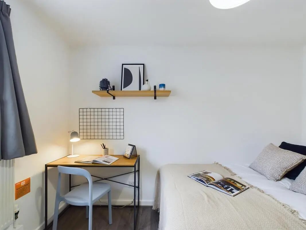 Desk chair lamp shelf and bed bedroom at 6 Bedroom House at 2, Flat 2, Windsor House, Clint Road West in Liverpool Student Accommodation