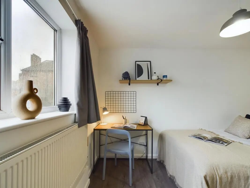 Desk chair lamp bed and vases bedroom at 6 Bedroom House at 2, Flat 2, Windsor House, Clint Road West in Liverpool Student Accommodation
