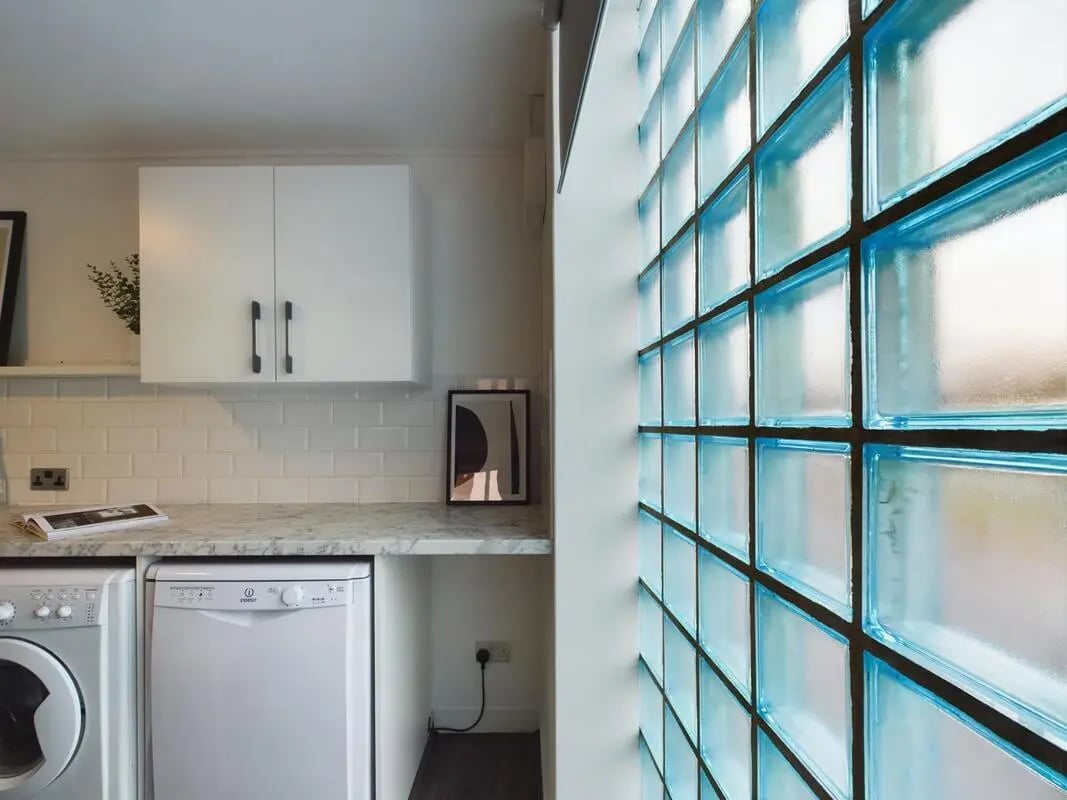 Washing machine dishwasher cabinets tiled backsplash utility area at 6 Bedroom House at 2, Flat 2, Windsor House, Clint Road West in Liverpool Student Accommodation