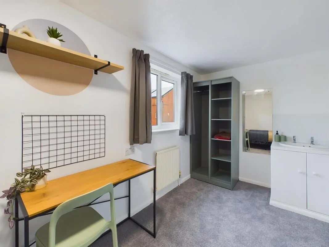 Desk wardrobe shelf and sink bedroom at 6 Bedroom House at 1, Sage Road in Leicester Student Accommodation