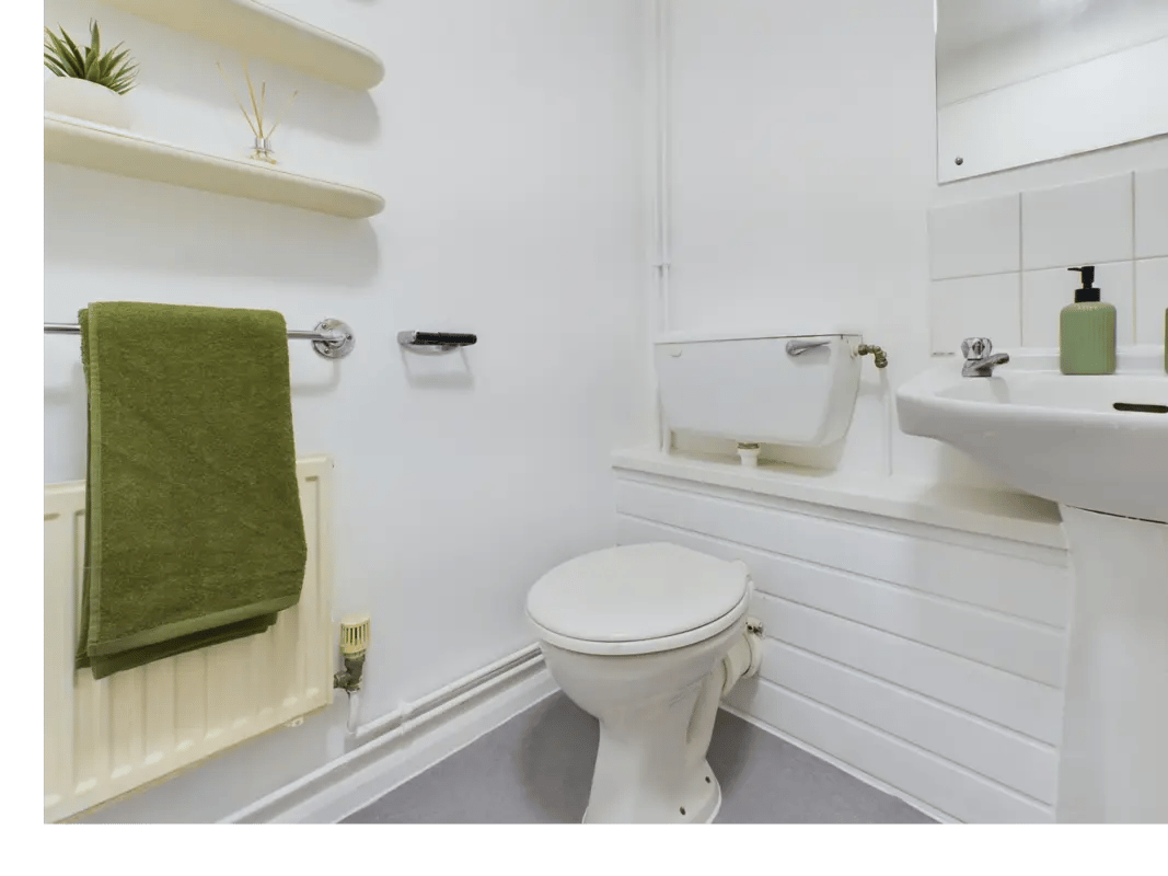 Toilet sink towel rack and shelving bathroom at 6 Bedroom House at 1, Sage Road in Leicester Student Accommodation