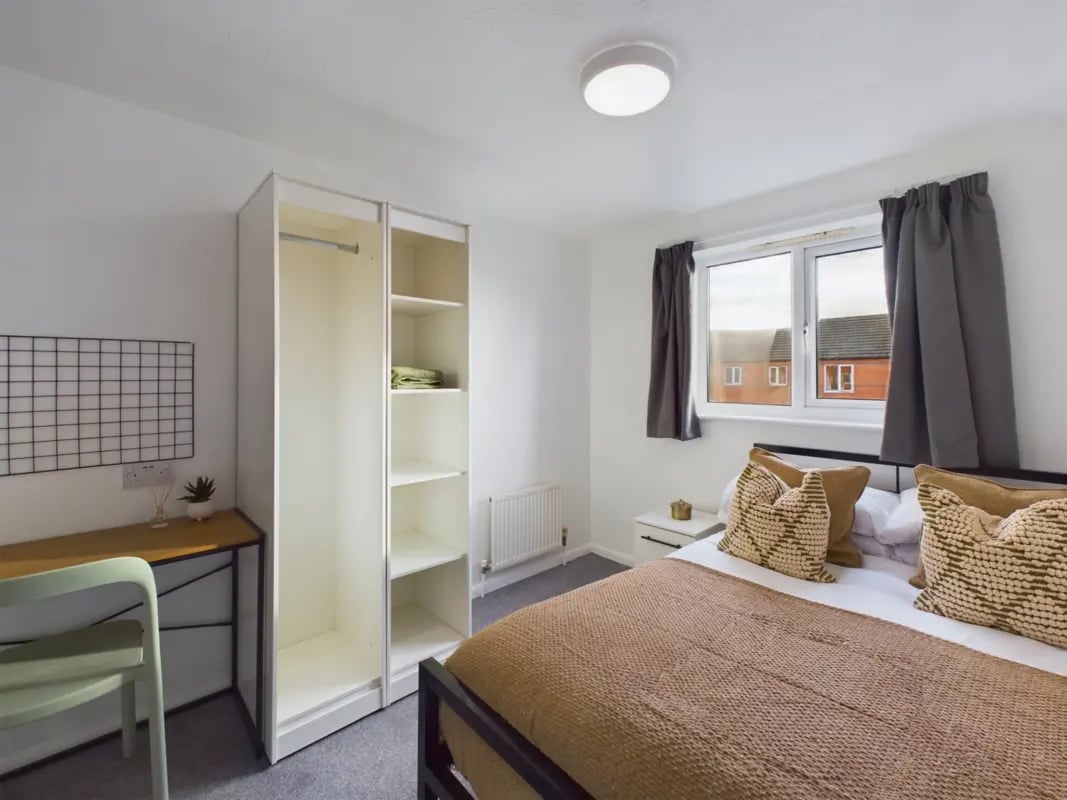 Bed desk wardrobe and pillows bedroom interior at 6 Bedroom House at 5, Mint Road in Leicester Student Accommodation