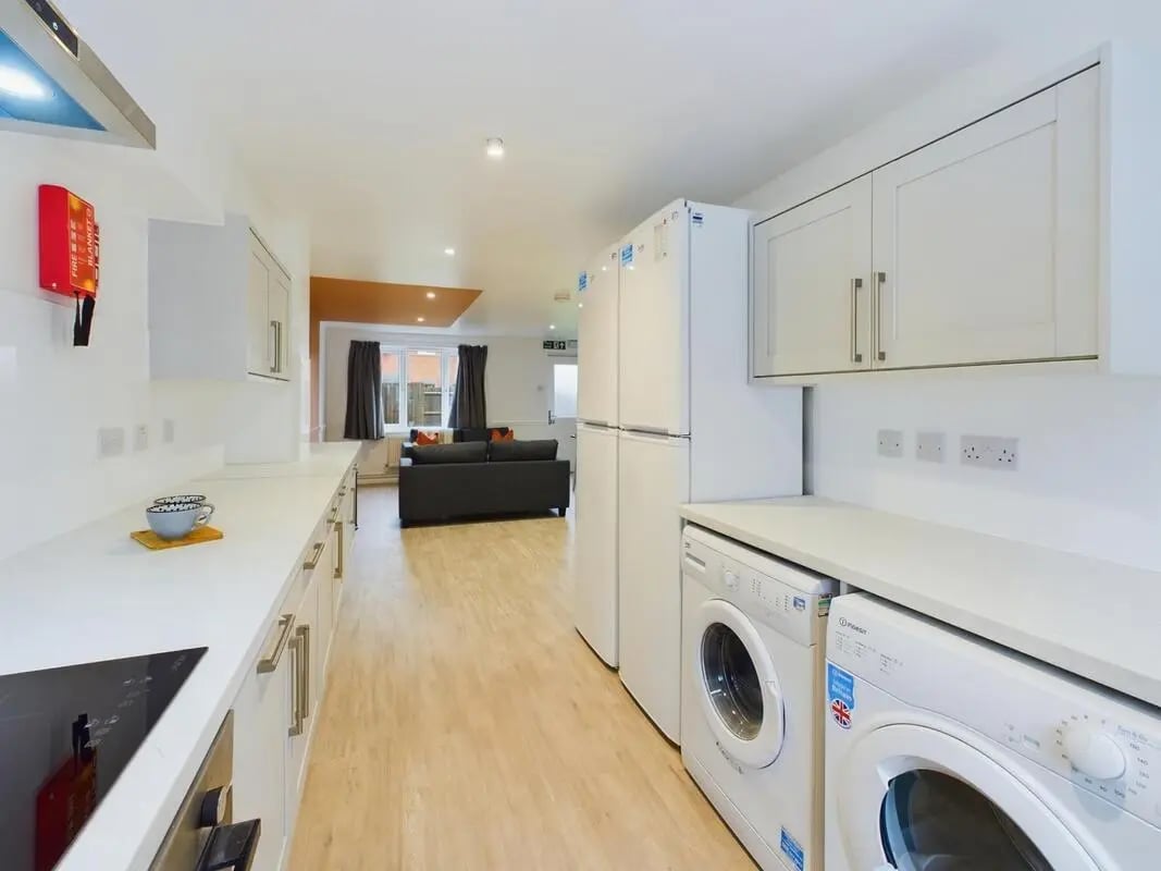 Kitchen with two fridges and washing machines living area Kitchen at 6 Bedroom House at 7, Sage Road in Leicester Student Accommodation