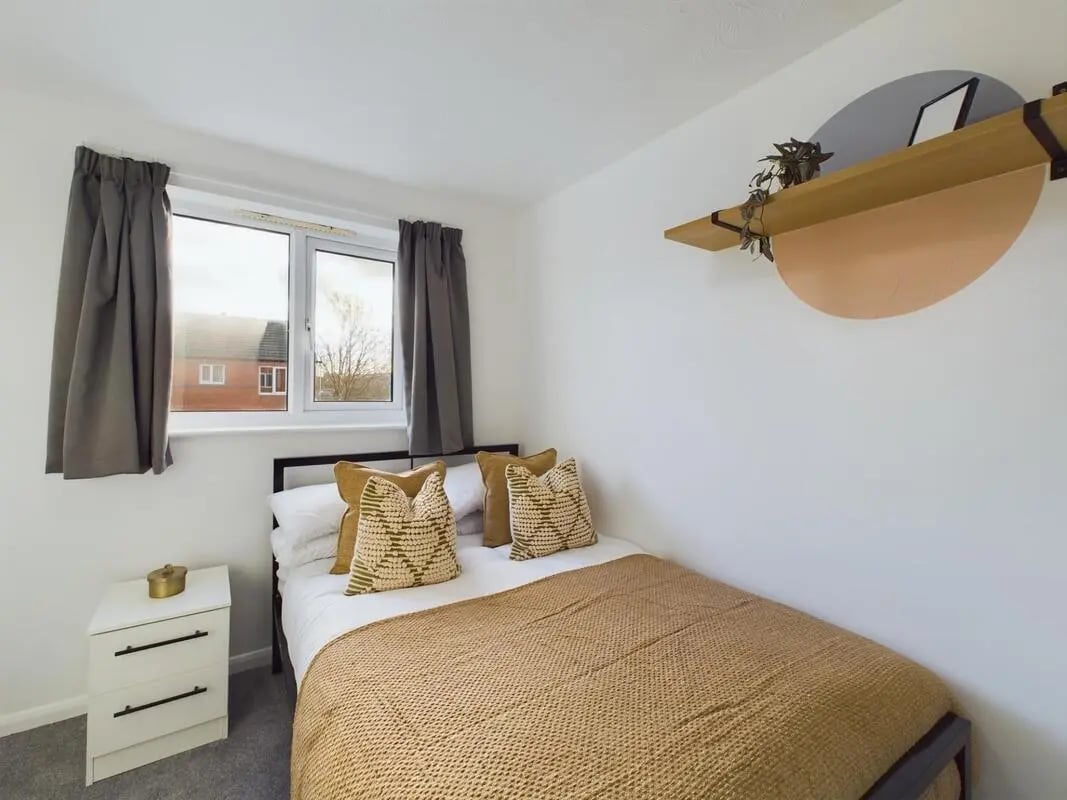 Bed dresser pillows curtains on window bedroom at 6 Bedroom House at 9, Sage Road in Leicester Student Accommodation