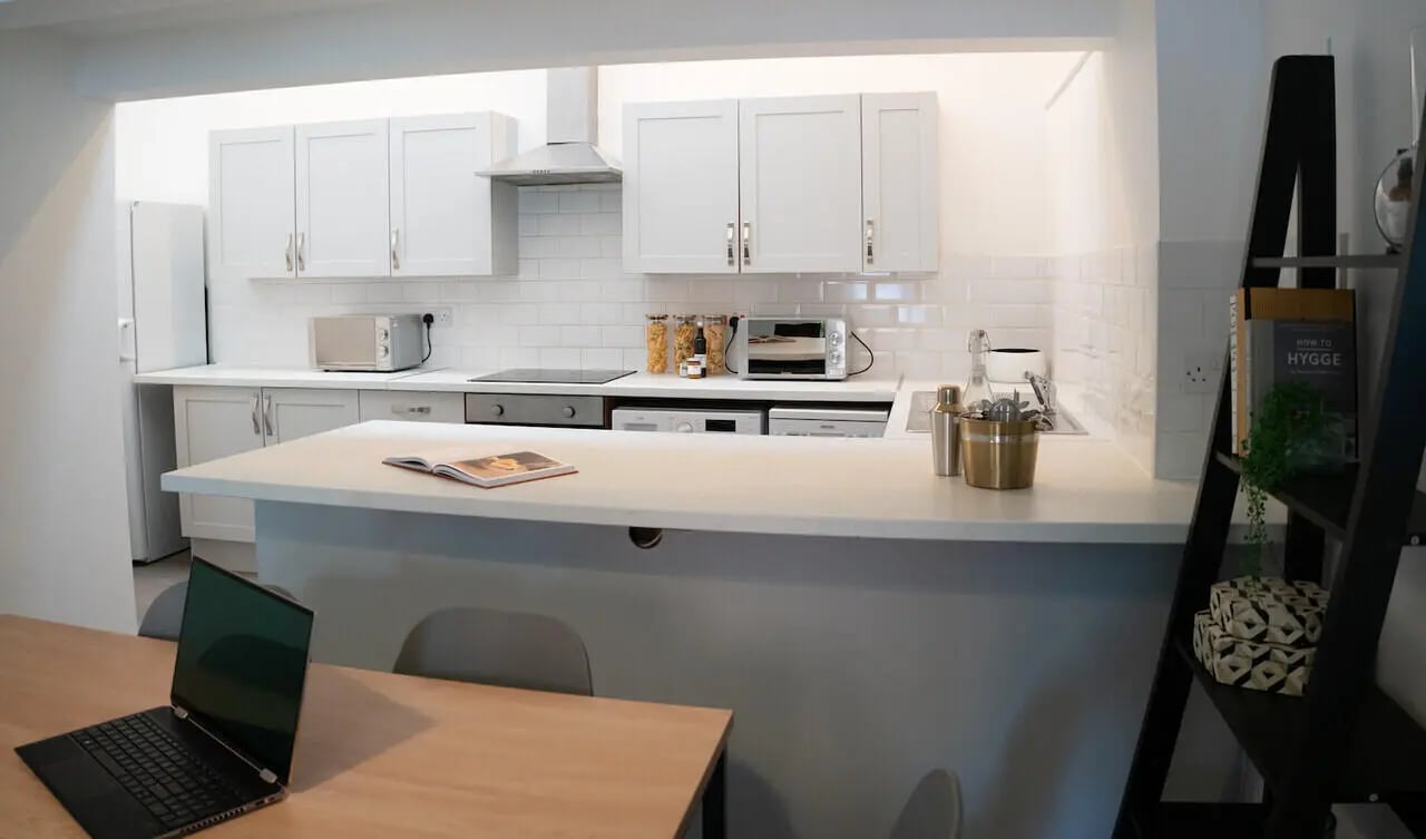 White cabinets oven microwave fridge counter kitchen at 6 Bedroom House at 64A, Monson Street in Lincoln Student Accommodation