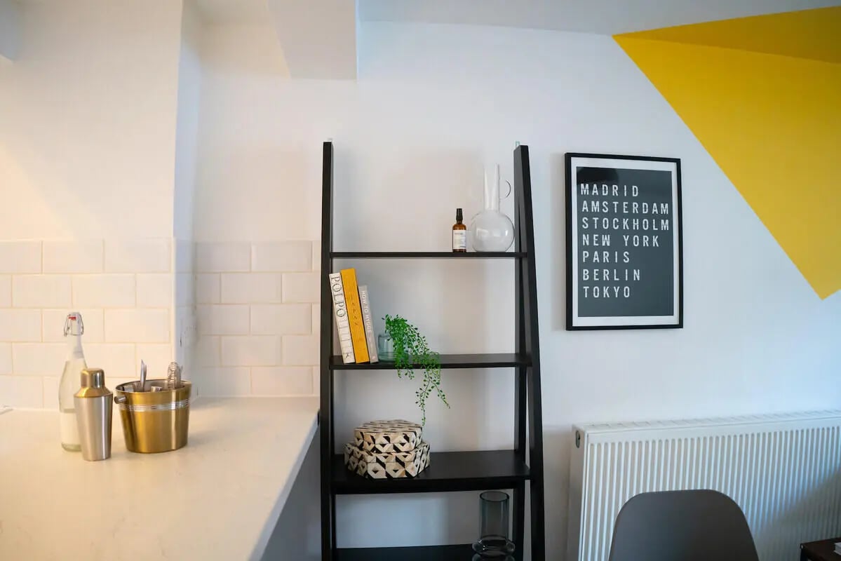 Shelving with books artwork and kitchen items kitchen at 6 Bedroom House at 64A, Monson Street in Lincoln Student Accommodation