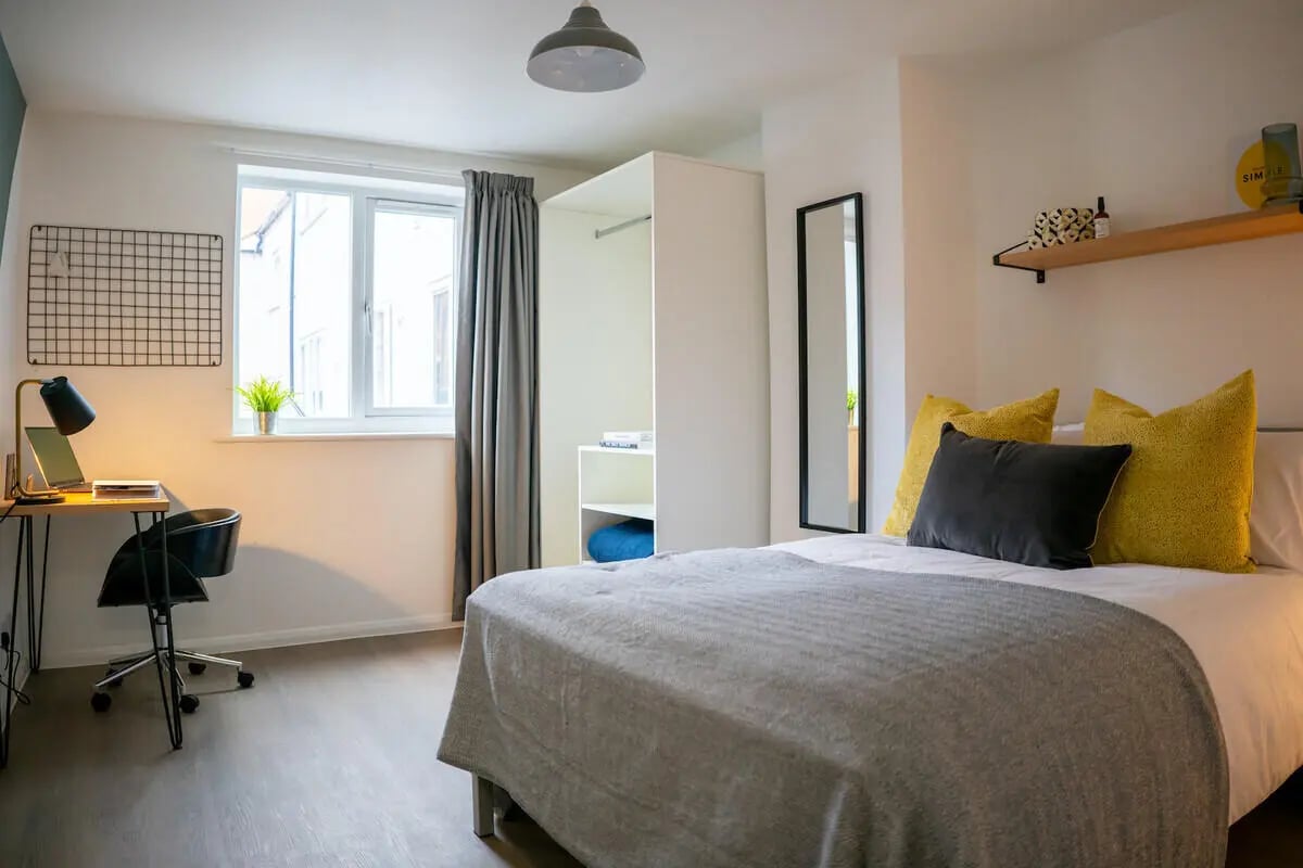 Desk chair lamp laptop grid closet bed bedroom at 6 Bedroom House at 64A, Monson Street in Lincoln Student Accommodation