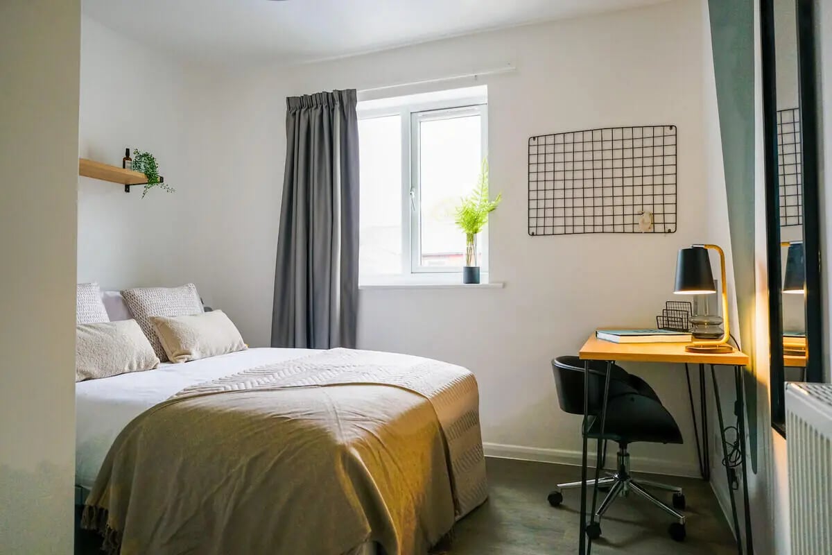 Bed desk chair plant and mirror bedroom at 6 Bedroom House at 64A, Monson Street in Lincoln Student Accommodation