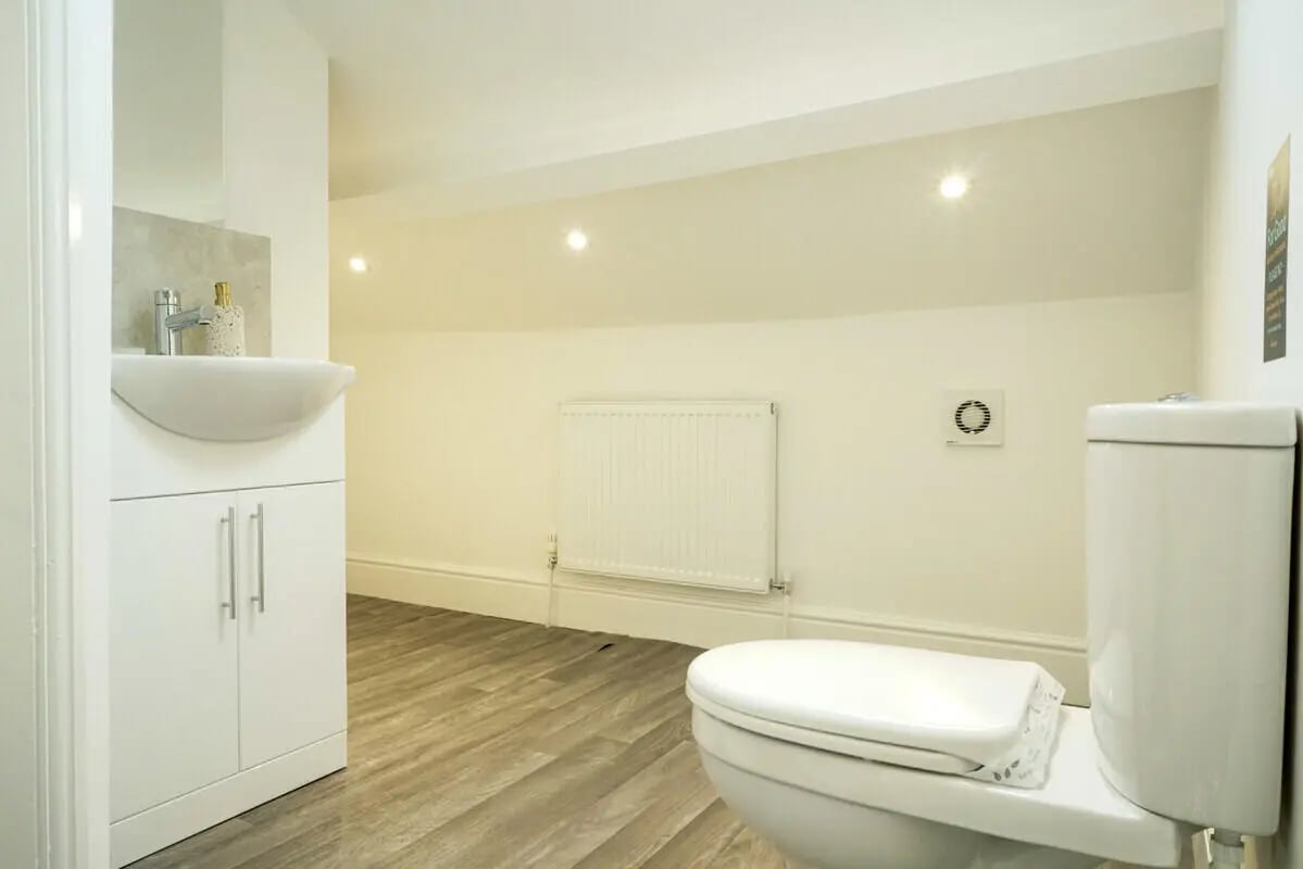 Toilet sink and radiator clean modern bathroom at 6 Bedroom House at 1, Baggholme Road in Lincoln Student Accommodation