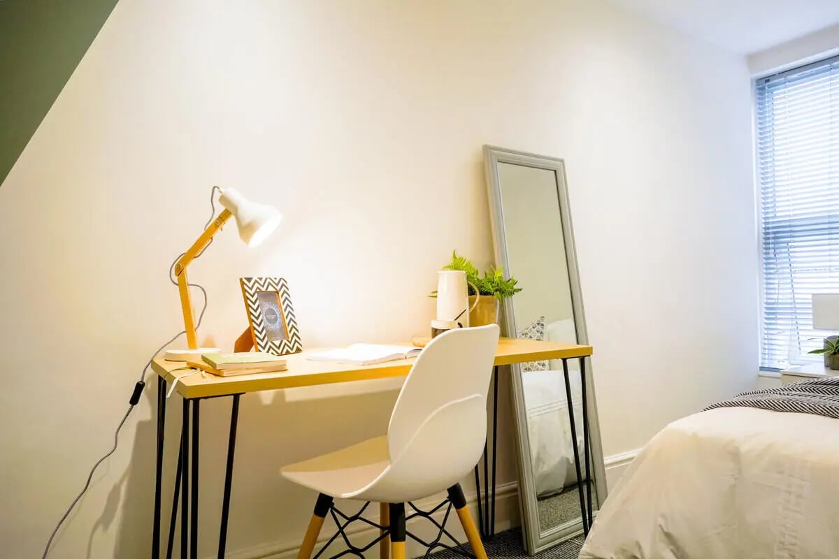 Desk lamp picture frame chair mirror bedroom study area at 6 Bedroom House at 1, Baggholme Road in Lincoln Student Accommodation