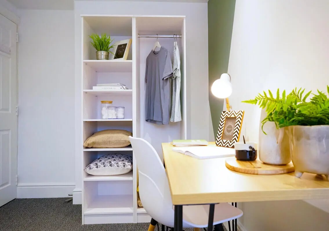 Wardrobe desk chair and plants study area at 6 Bedroom House at 1, Baggholme Road in Lincoln Student Accommodation