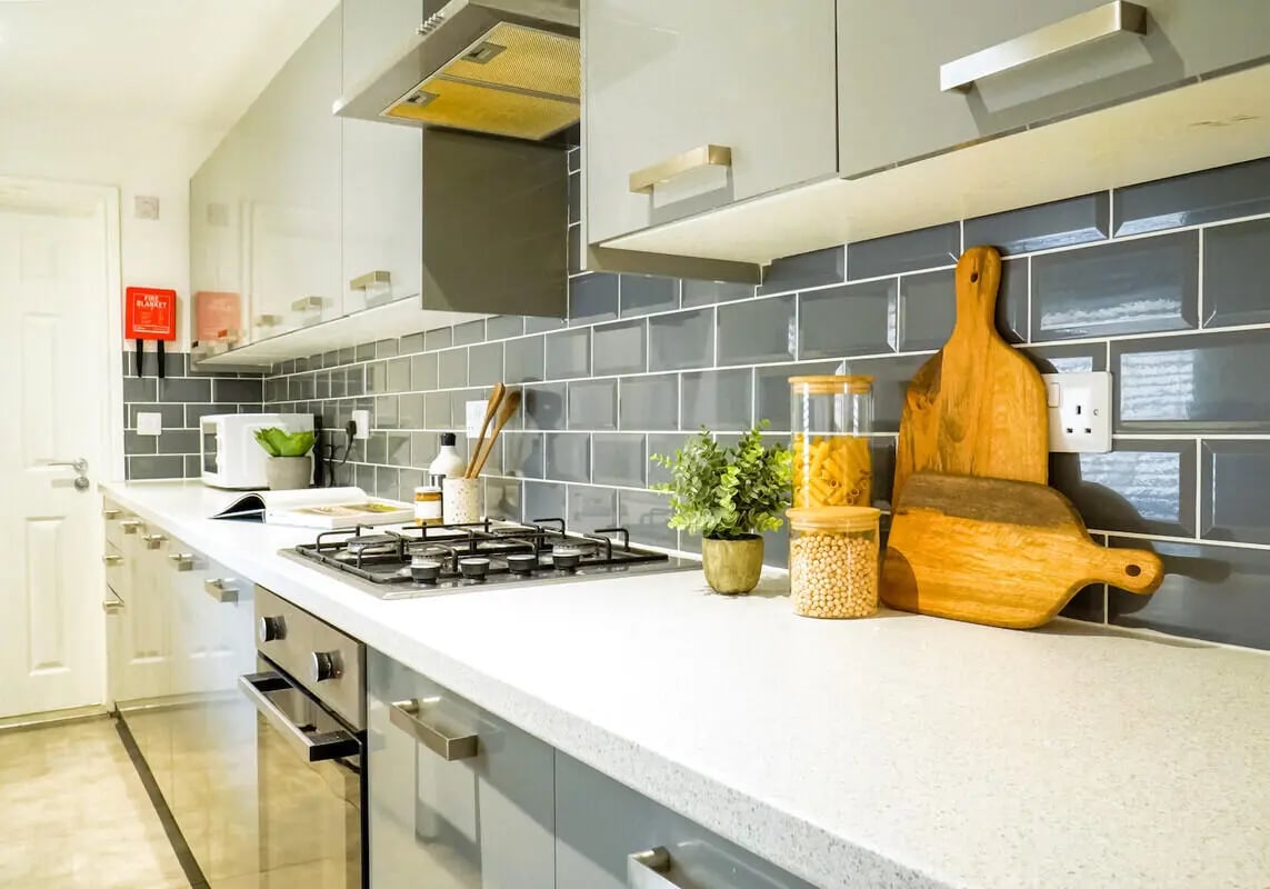 Countertop with stovetop microwave and jars Kitchen at 6 Bedroom House at 1, Baggholme Road in Lincoln Student Accommodation