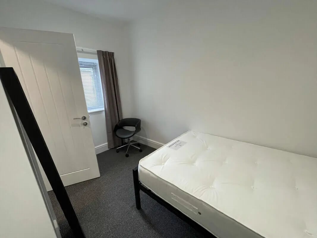 Bed mattress chair and door Bedroom at 2 Bedroom House at 20 G, Portland Street in Lincoln Student Accommodation